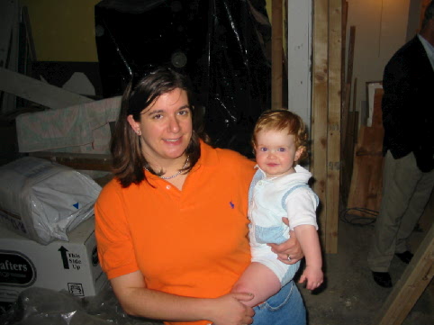 Bethany holding Jane on a tour of the joint with Gramy and Gral